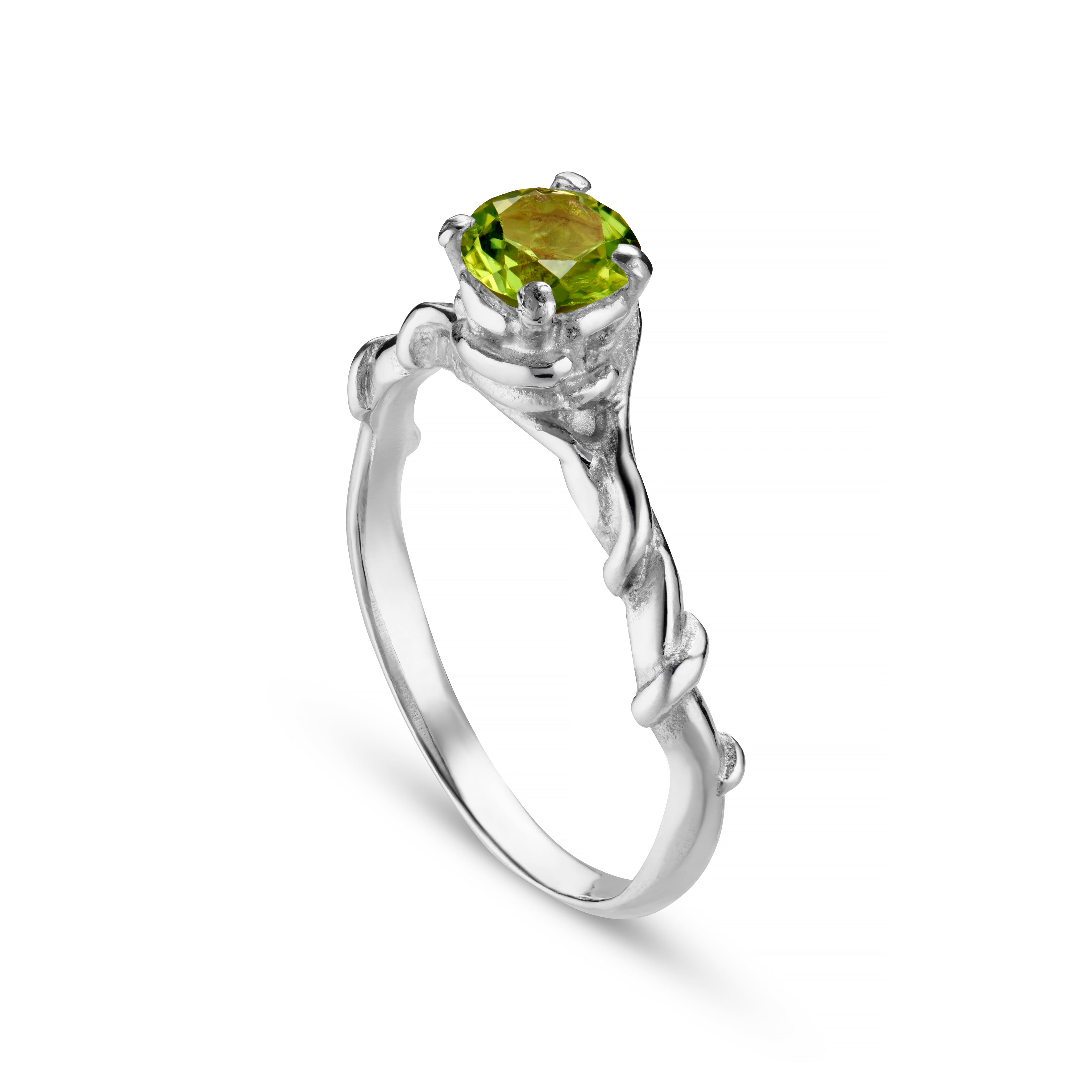 A silver ring with an intricate vine design featuring a central faceted gemstone.