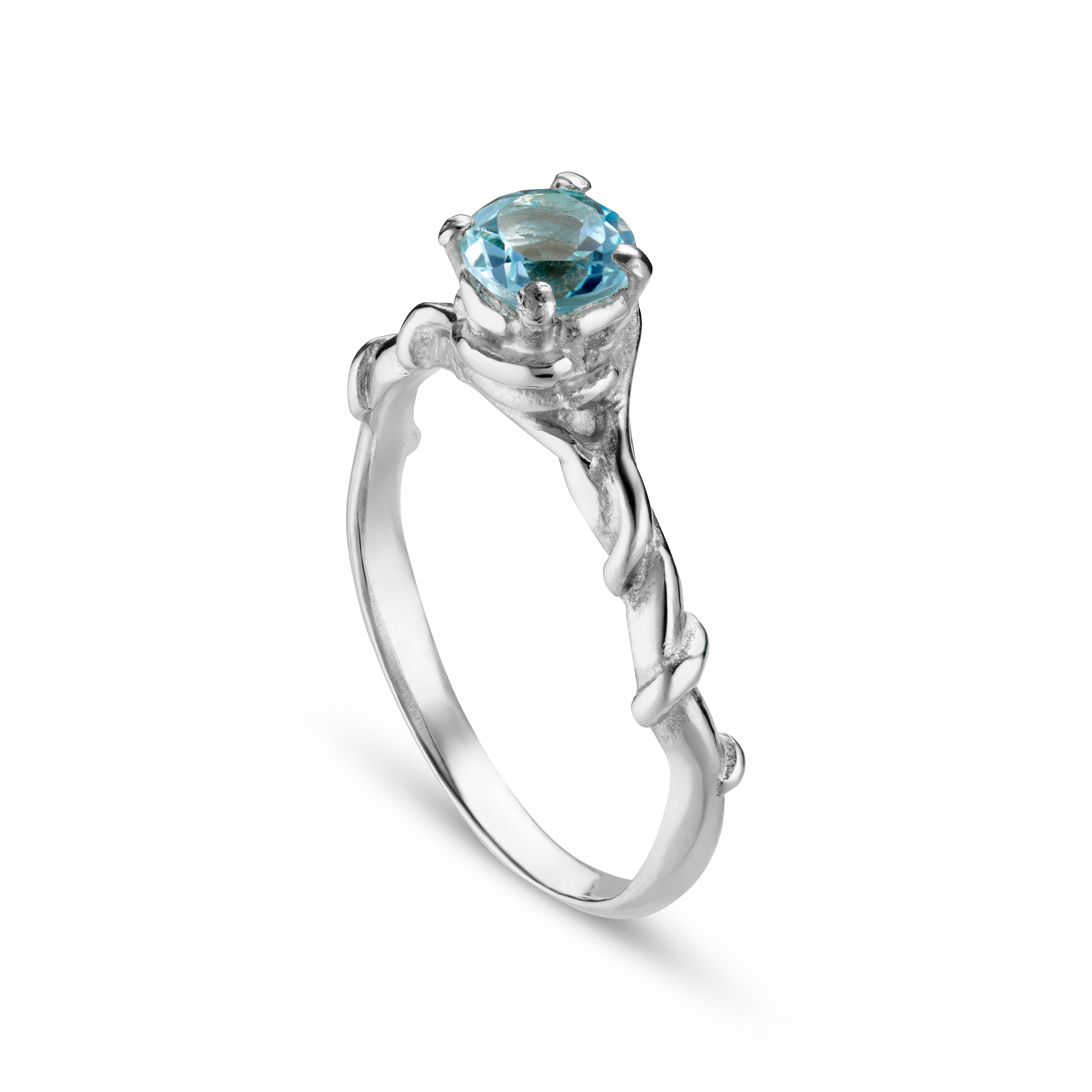 A silver ring with an intricate vine design featuring a central faceted gemstone.