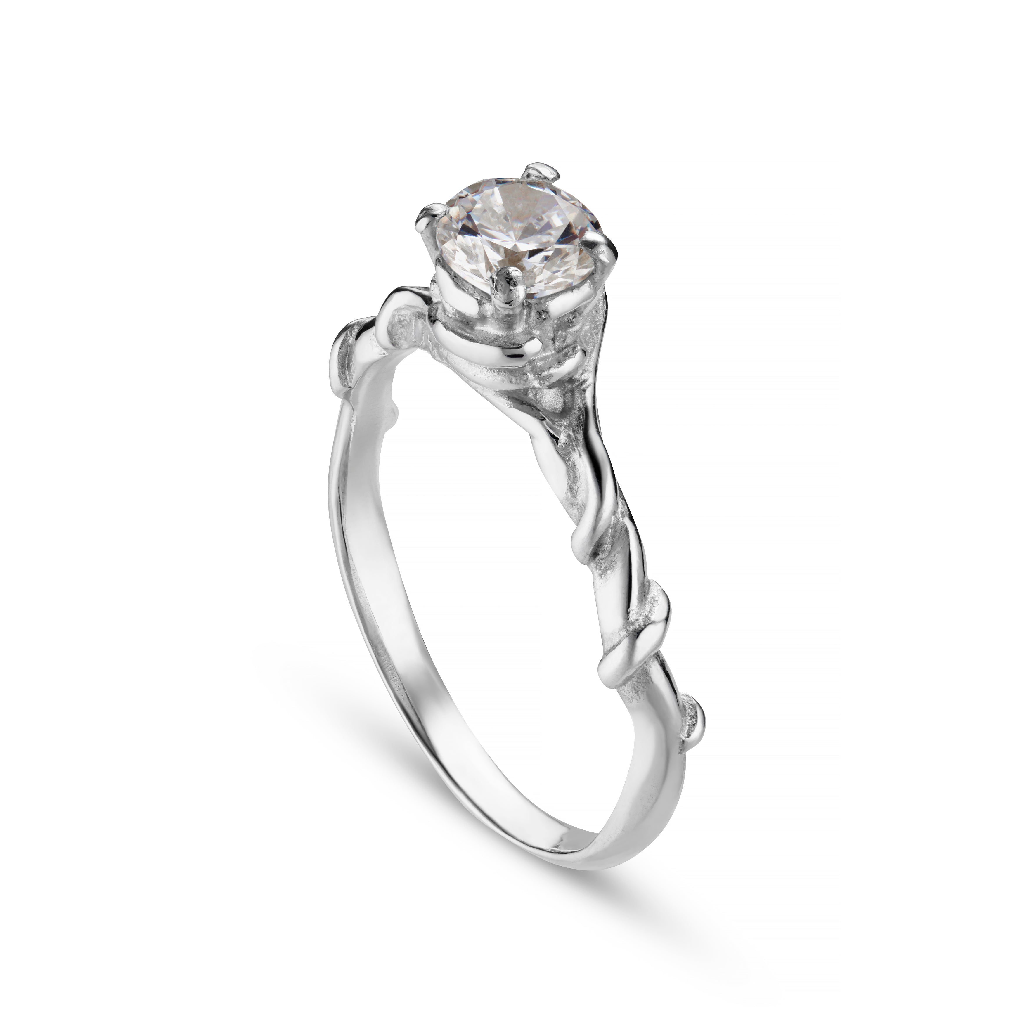 A silver ring with an intricate vine design featuring a central faceted gemstone.