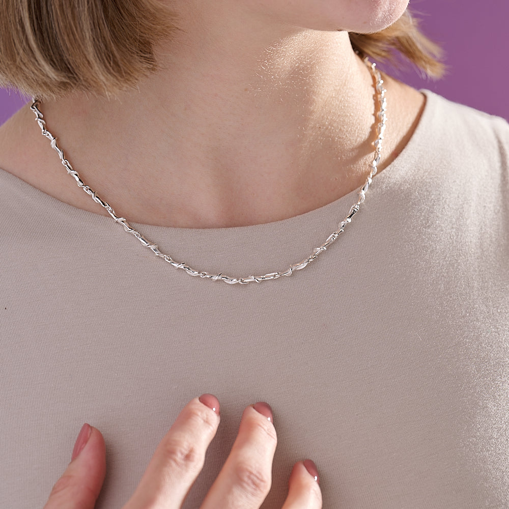 Entwine silver necklace on model