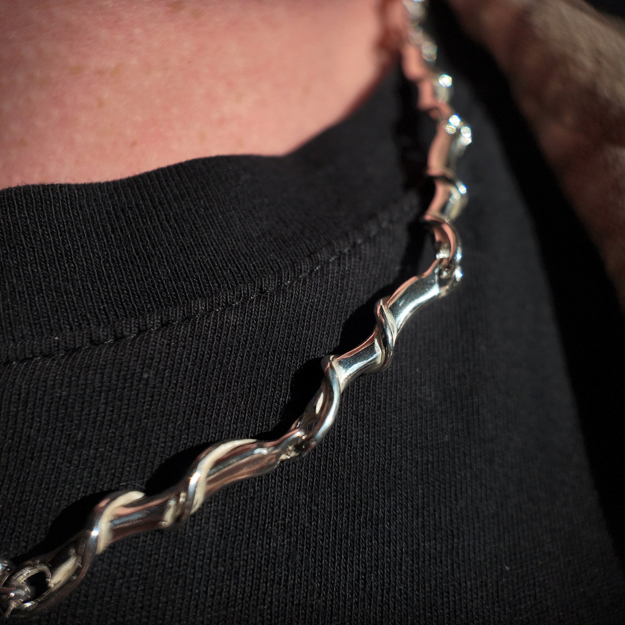 Entwine large link silver necklace close up neck shot