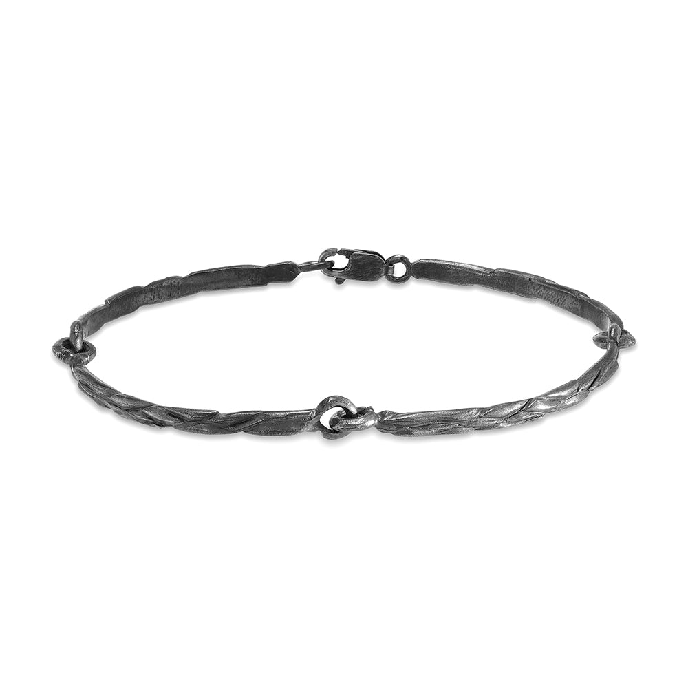 Forest Silver Bracelet. The detail resembles bark from oak forests.