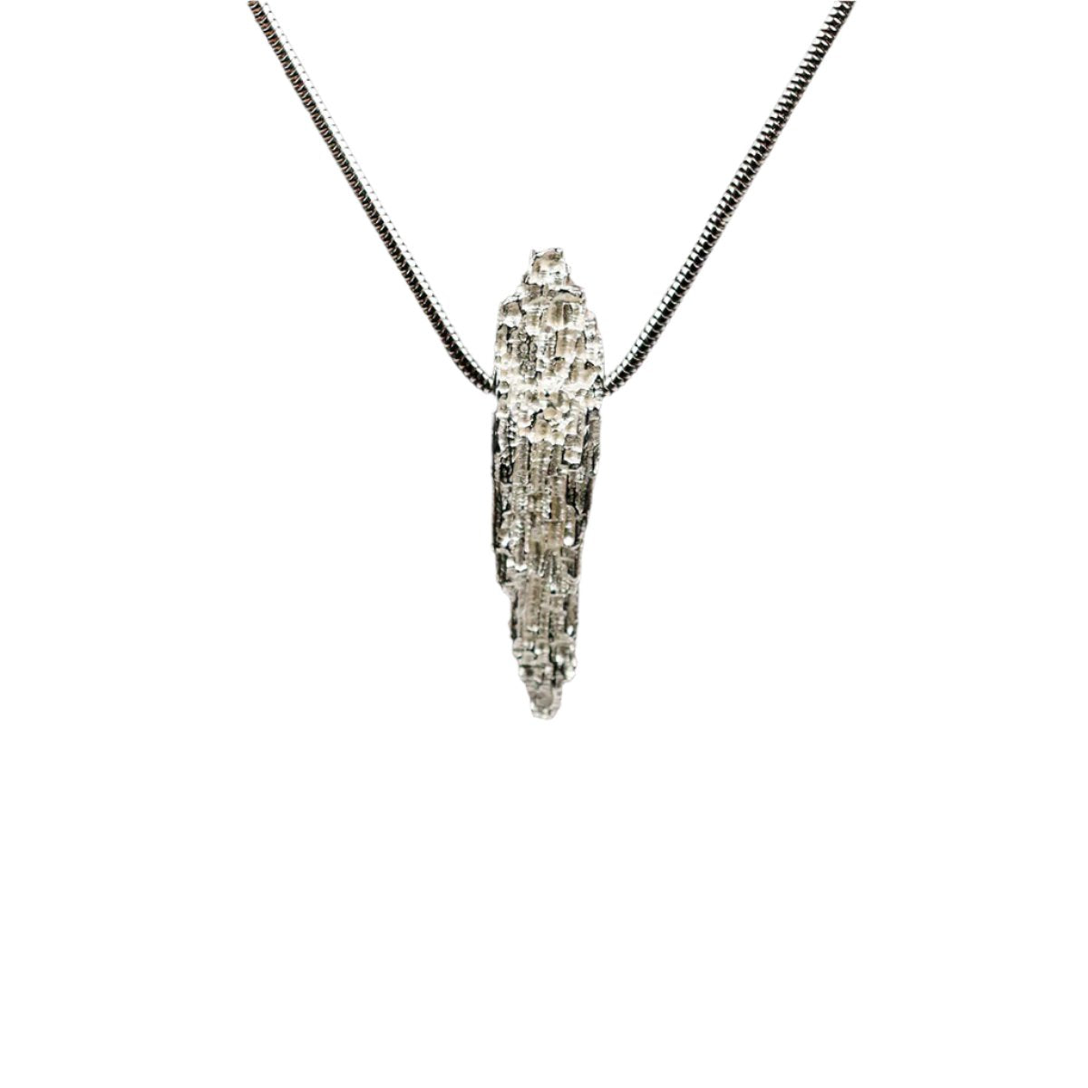 This Luna textured pendant by Jeremy Hoye hangs on an 18" silver snake chain.