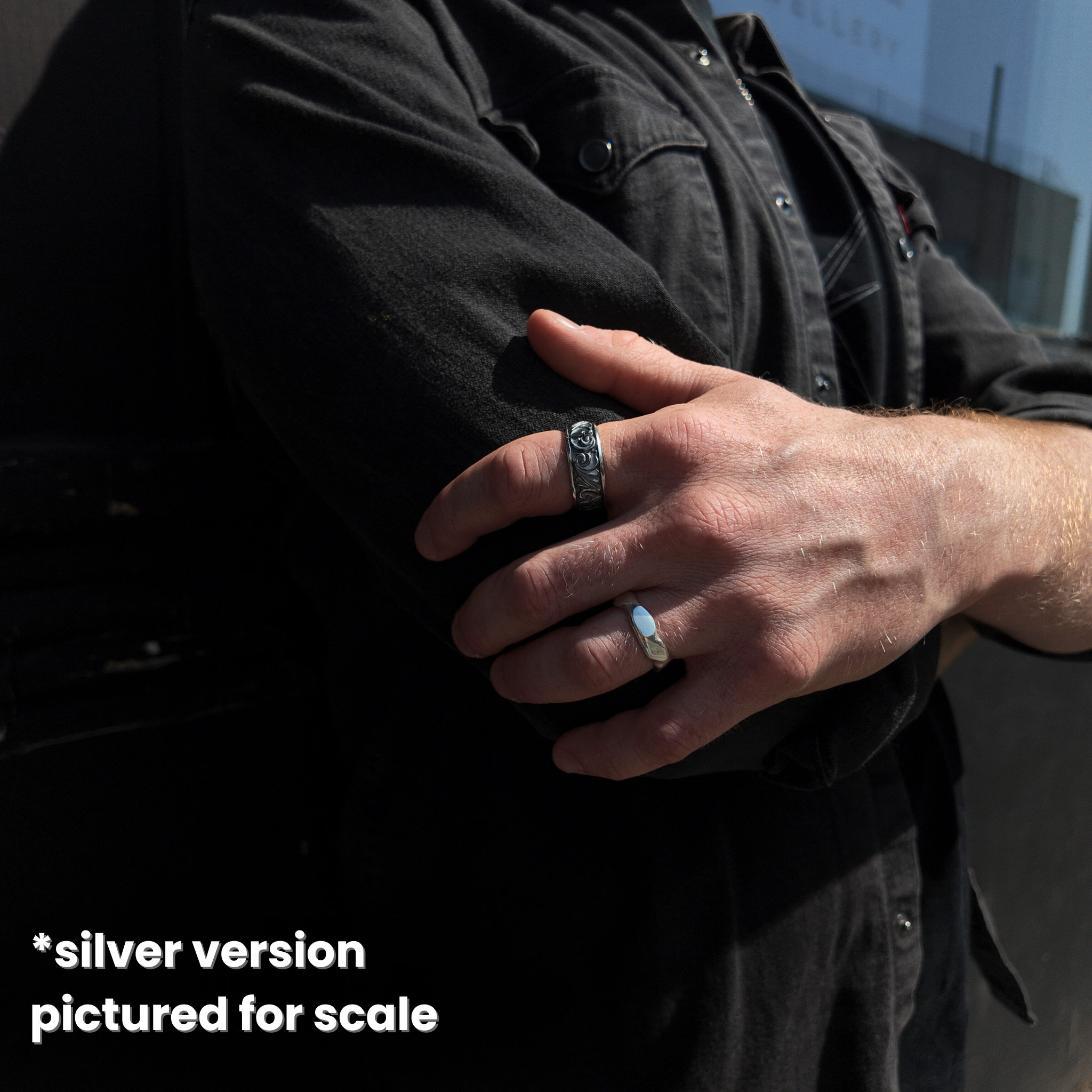 silver version shown for scale on hand whilst hand is holding arm