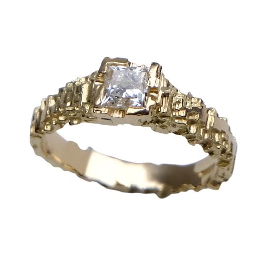 This unique solitaire is hand carved in 18ct yellow gold, and set with a beautiful .50pt princess cut diamond.