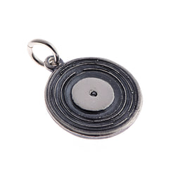 Handmade in silver, the miniature vinyl disc measures 16.5mm in diameter, and is finished with oxidised detailing.