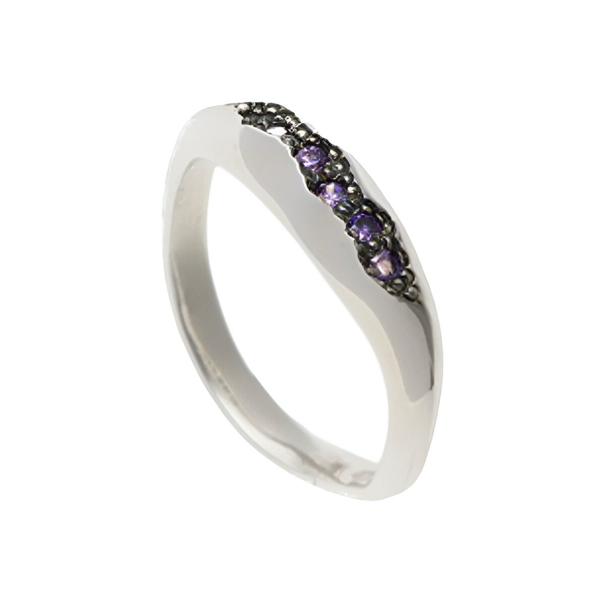 Measuring 4.5mm in width and tapering down to 3mm, this beautiful silver ring is pavé set with five cubic zirconia in purple.