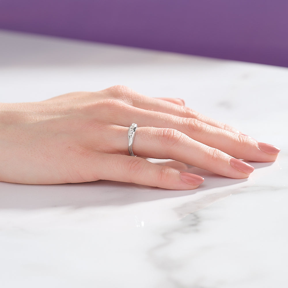 Measuring 4.5mm in width and tapering down to 3mm, this beautiful silver ring is pavé set with five cubic zirconia in white.