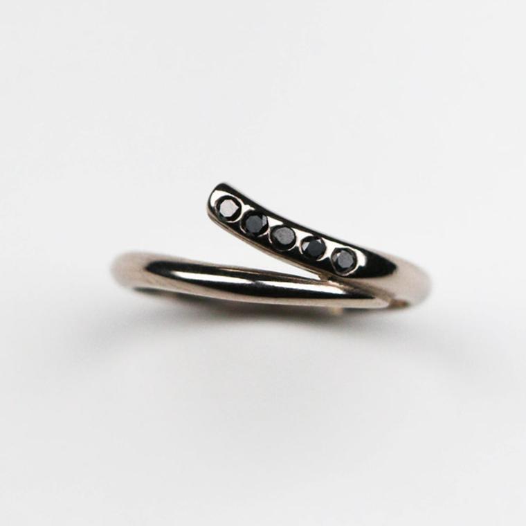 Handmade in 18ct white gold and set with five black diamonds which total .15pts of a carat.