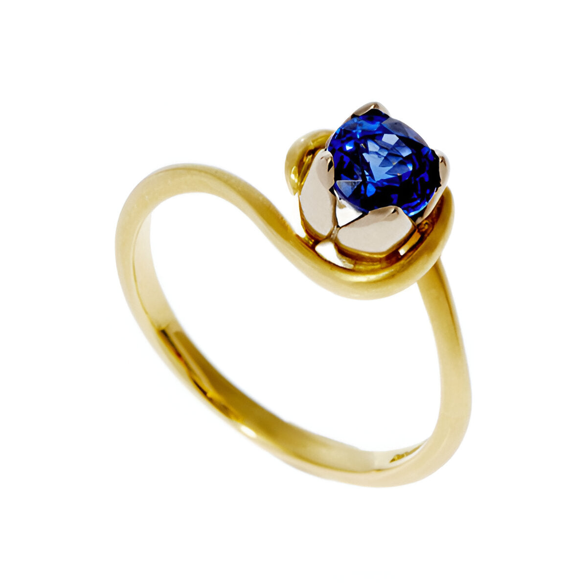 A simple, fine band handmade in 18ct yellow gold with contrasting rose gold four-petal setting. Set with .45pt round sapphire.