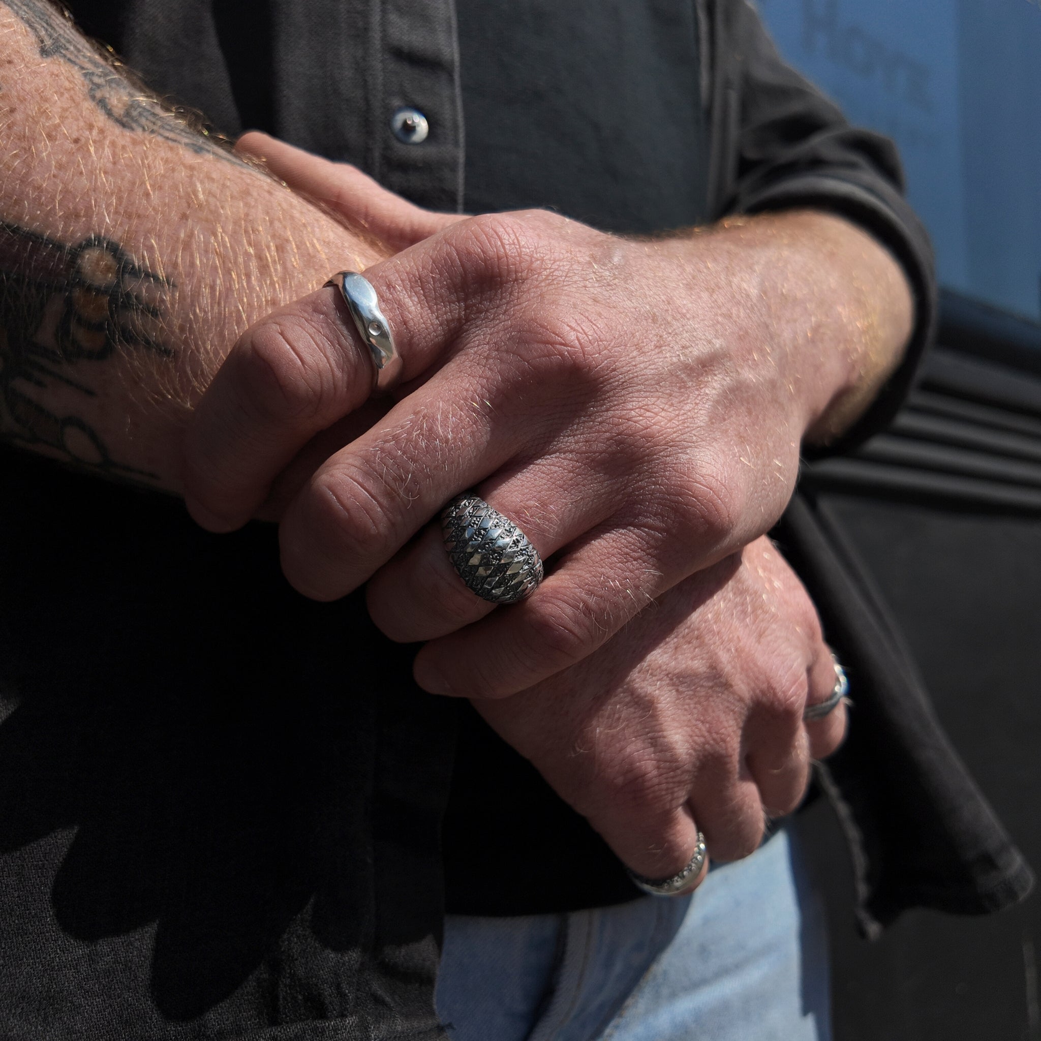 chequered bombe and carved medium ring handshot with hands crossed