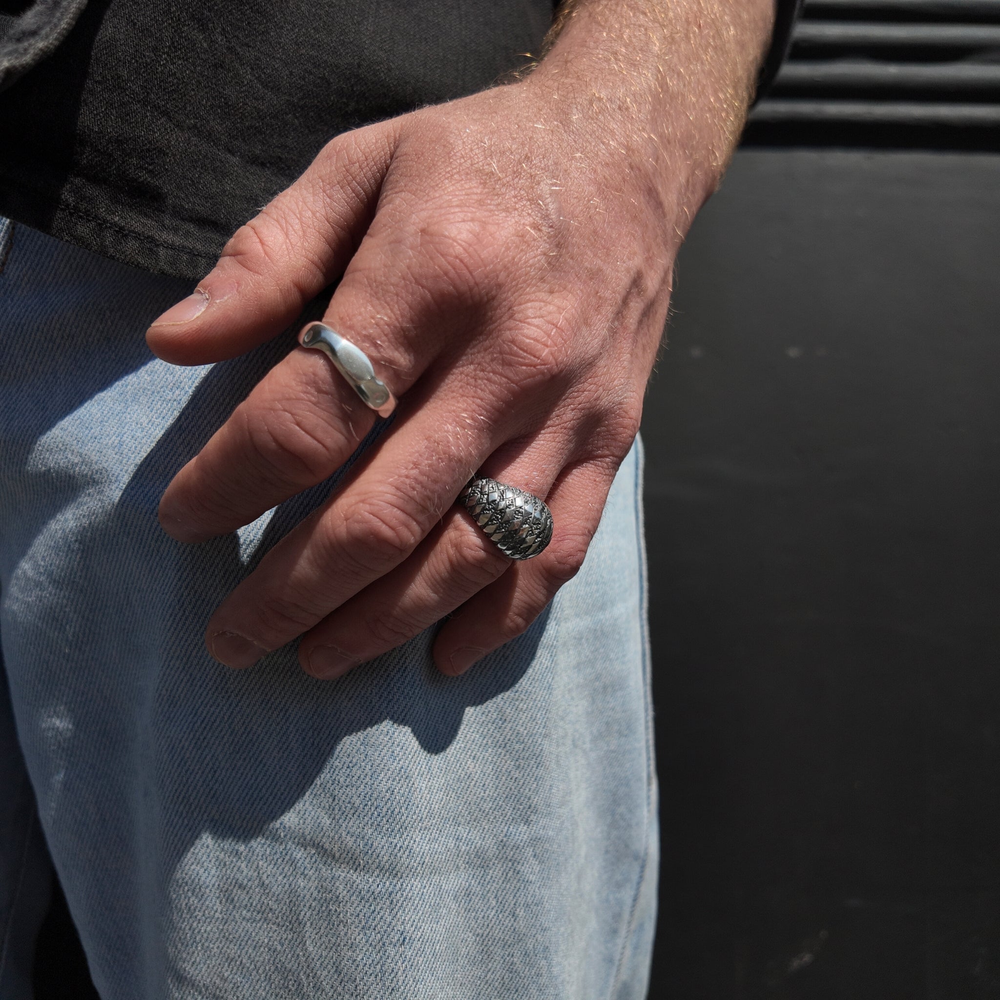 chequered bombe and carved medium ring handshot hand by waist