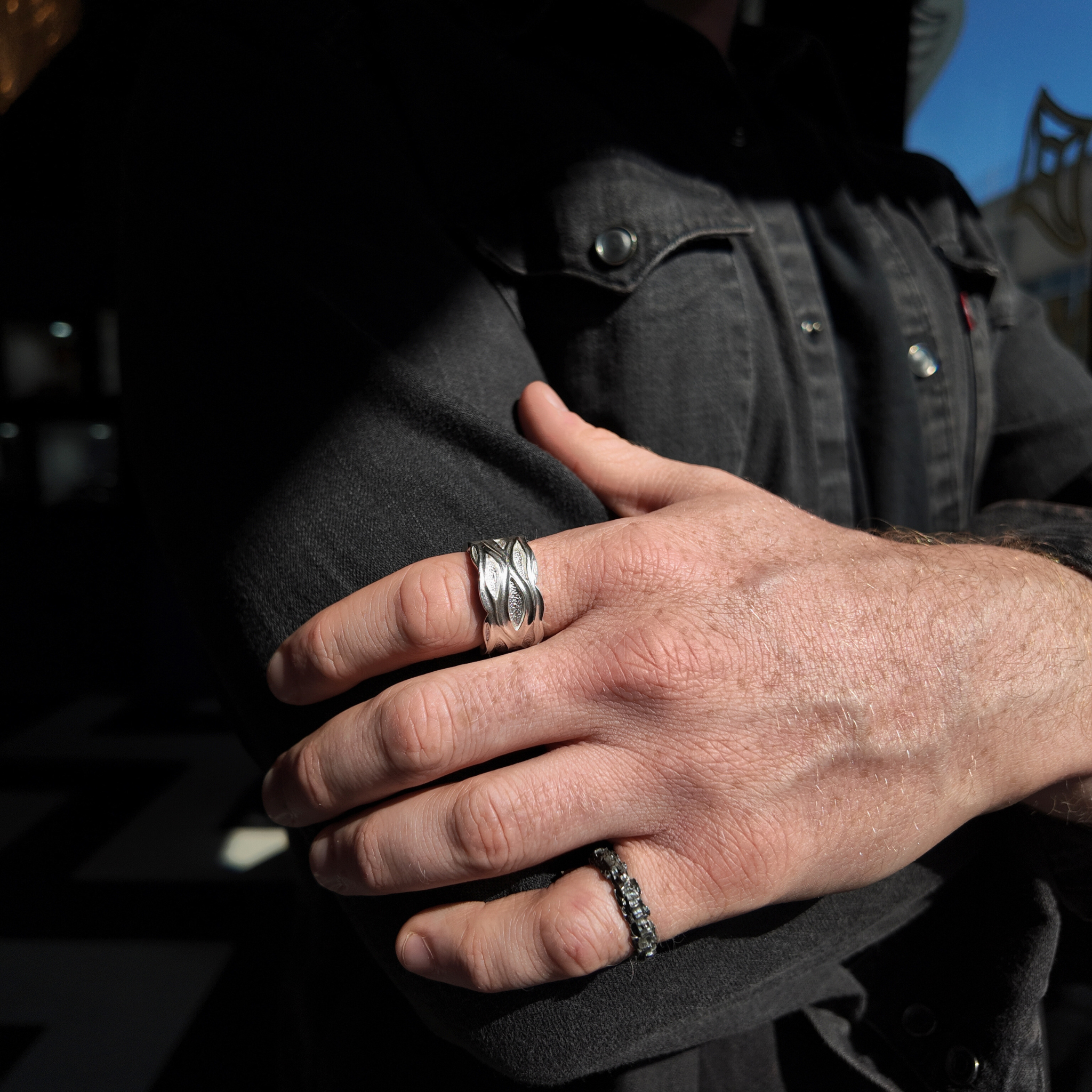luna silver all rough style ring with an oxidised finish on a hand