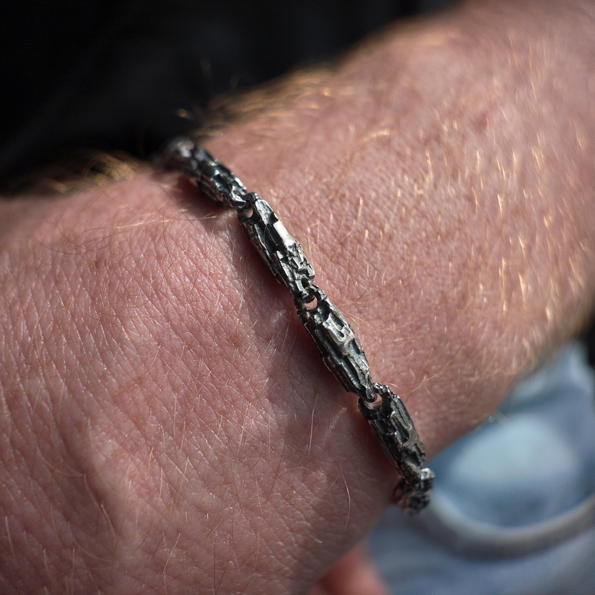 Oxidised small Luna silver bracelet macro shot on wrist